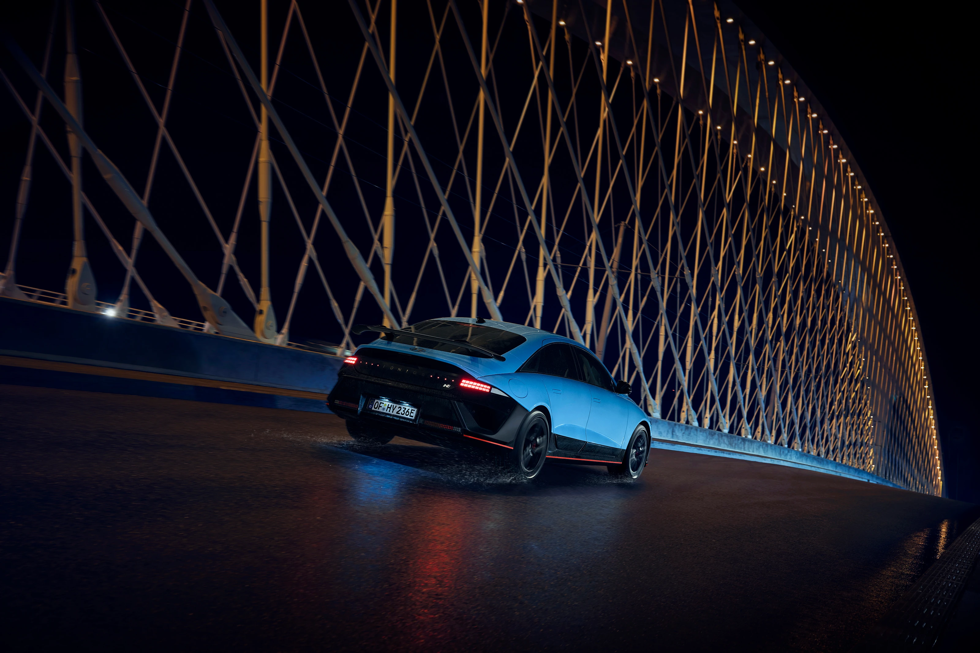 Hyundai IONIQ 6N Exterior Rear Quarter Driving At Night 30 IONIQ 6N Night Driving Rear Quarter