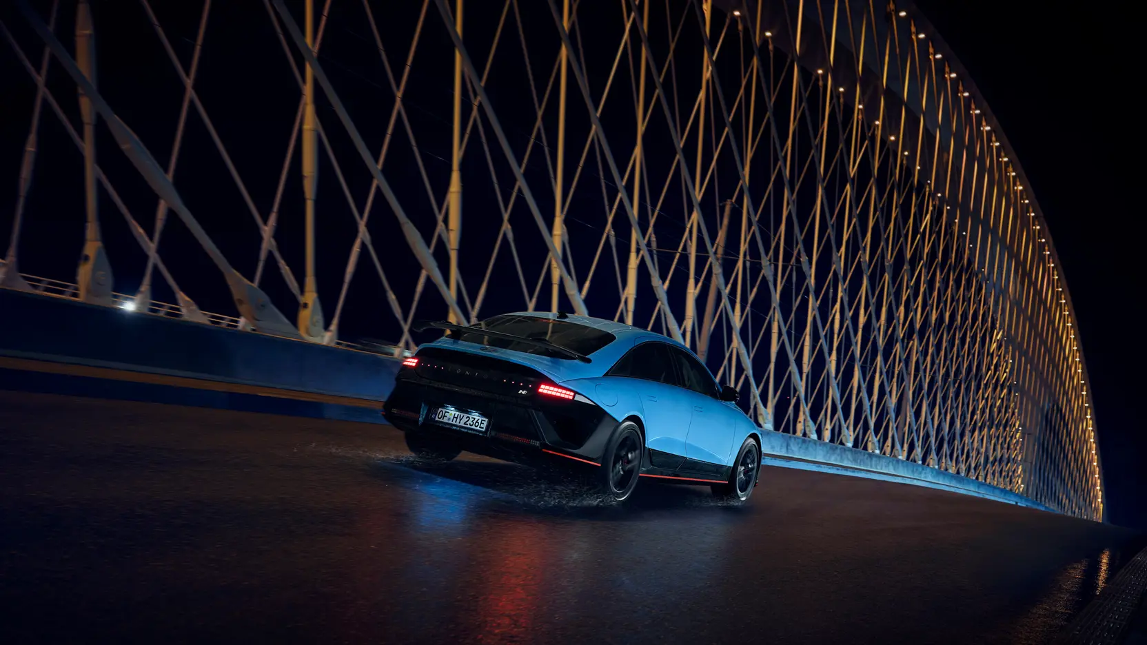 Hyundai IONIQ 6N Exterior Rear Quarter Driving At Night 30 IONIQ 6N Night Driving Rear Quarter